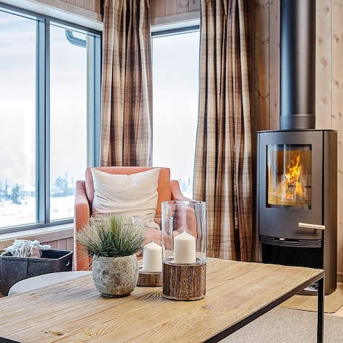 Get cosy by the wood burner as you watch the snow falling