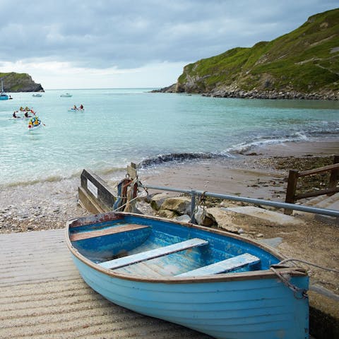Breathe in the sea air at Lulworth Cove, just three miles away