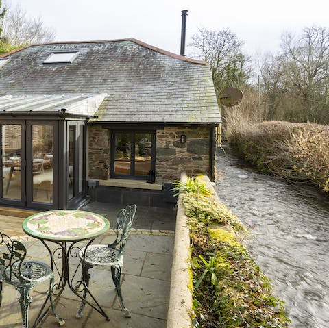 Stay in a converted barn right beside the little Harbourne River