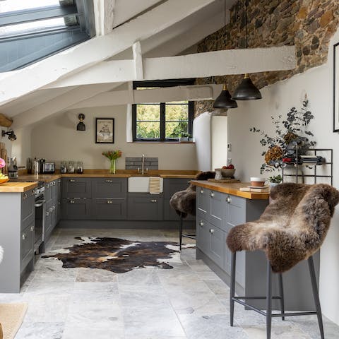 Admire the home's character features like the exposed stone walls and beams
