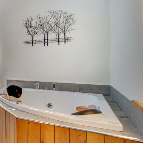 Luxuriate in the tub in the master suite