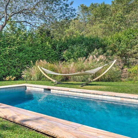 Swim laps of the heated pool or lounge in the hammock poolside