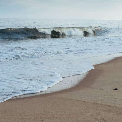 Surf, swim and sunbathe at Ditch Plains Beach, a nineteen-minute walk away