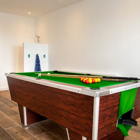 Play a few games of pool with family and friends