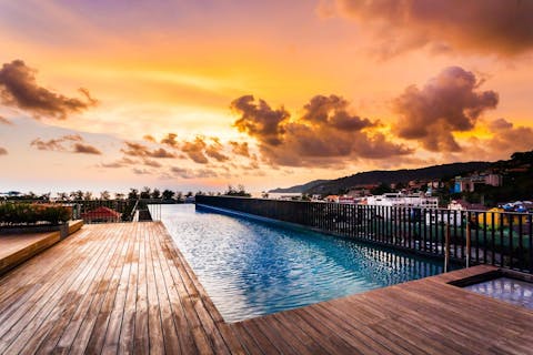 Don't miss sunsets on your rooftop pool – nothing beats watching the sun lower into Patong Bay