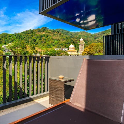 Enjoy morning coffees on your balcony, overlooking the tropical mountains