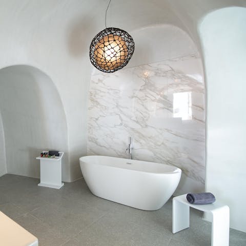 Enjoy a soak in the en-suite bathtub, surrounded by traditional arches
