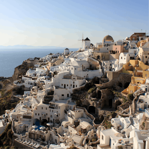 Stay on the cliffside of Oia, overlooking the volcanic caldera in the Aegean Sea
