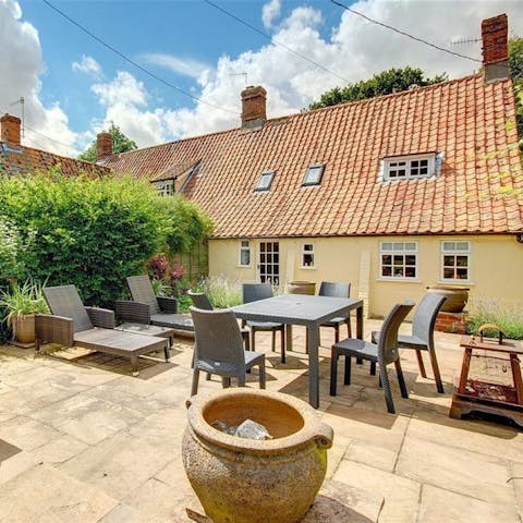 Soak up the last of the day's warm weather on the terrace with a pint