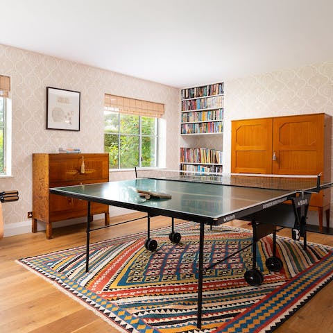 Play a few rounds of table tennis in your games room