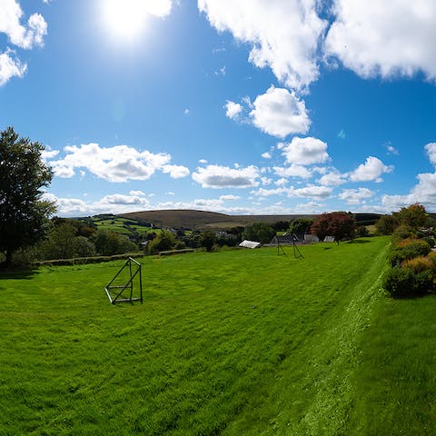 Kick around a football in the luscious garden