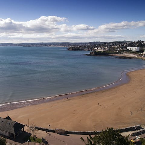 Pack up your beach bag and stroll down to Torquay Beach, just a few steps away