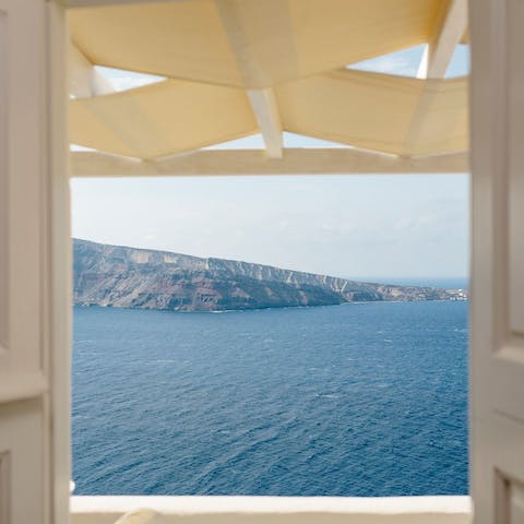 Admire the beautiful views of the Caldera and Aegean Sea