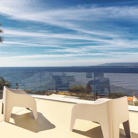 Soak up views over the Mediterranean Sea from the balcony terrace