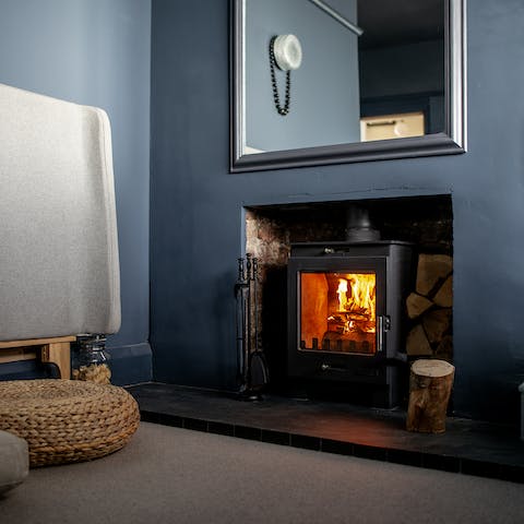 Snuggle up by the crackling fire in the bedroom