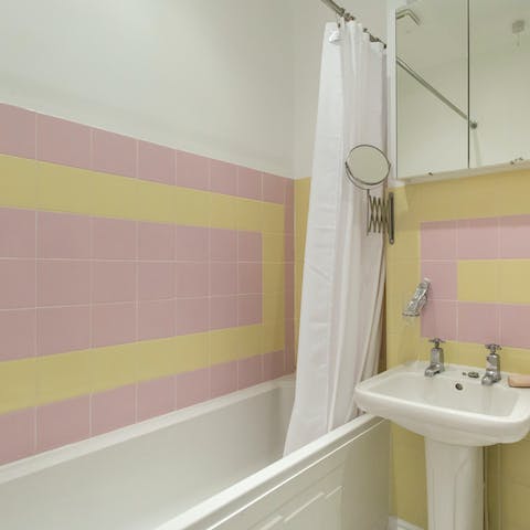 Run yourself a bubble bath in the brightly-coloured bathroom