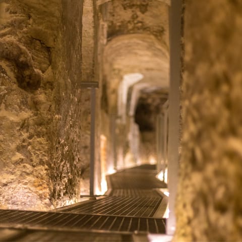 Explore Paris' Municipal Ossuary, The Catacombs, a short walk away