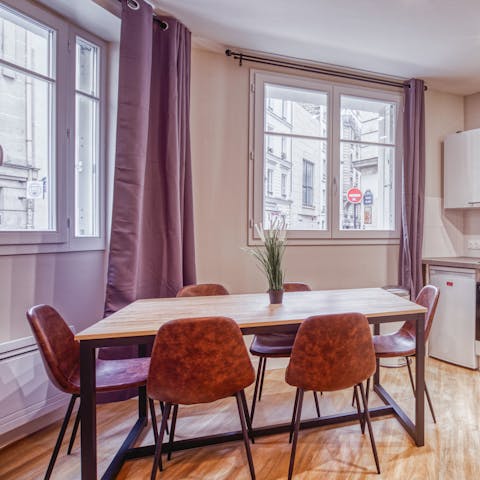 Enjoy mornings with pastries and coffee around the sleek dining table 