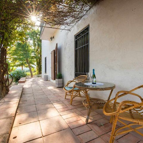 Open up a bottle of locally bought wine and enjoy under the shade of the verandah