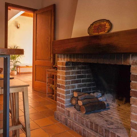 Light up the traditional wood-burning fireplace to get toasty at the end of the day
