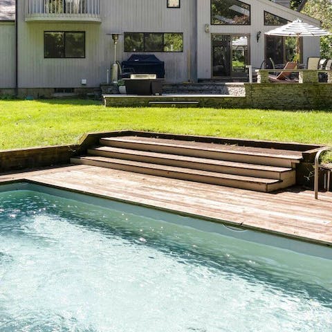 Take a dip in the garden's heated swimming pool 