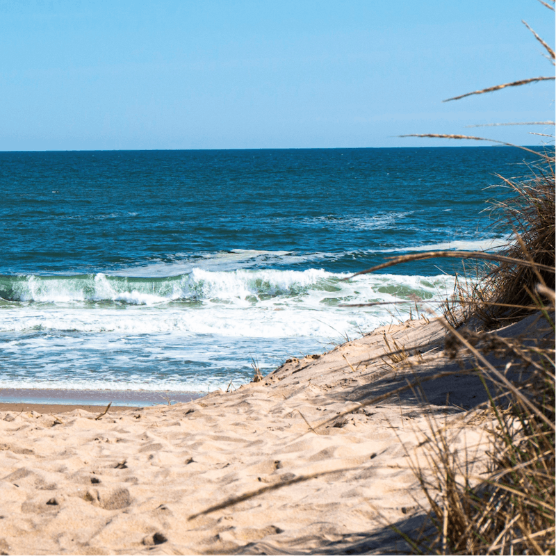 Stay just a ten-minute drive away from the sandy shores of Town Line Beach