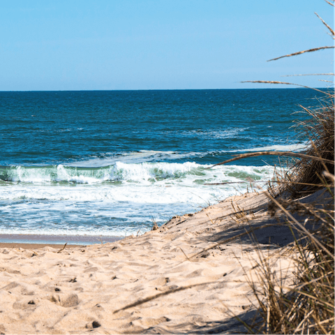 Stay just a ten-minute drive away from the sandy shores of Town Line Beach