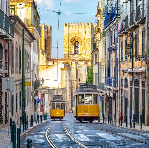 Hop on Lisbon's iconic trams –⁠ there's a stop less than five minutes away on foot