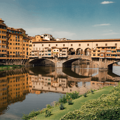 Stroll across scenic Ponte Vecchio, five minutes away on foot