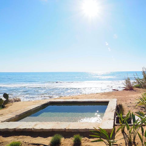 Enjoy a soak in the plunge pool as you admire the sea views