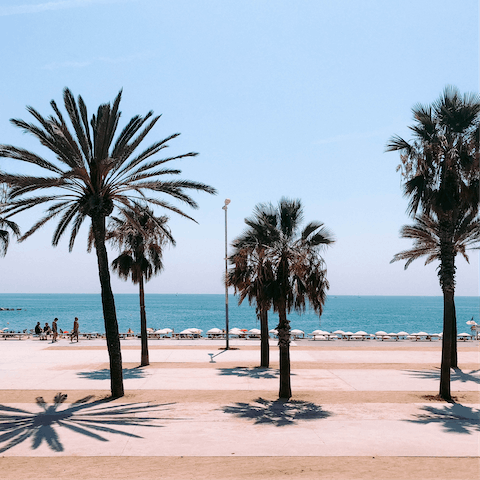 Grab your beach towel and head to Barceloneta Beach, just over a fifteen-minute walk