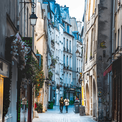 Get to know the local neighbourhood of Le Marais by strolling through its winding streets and popping into cafes