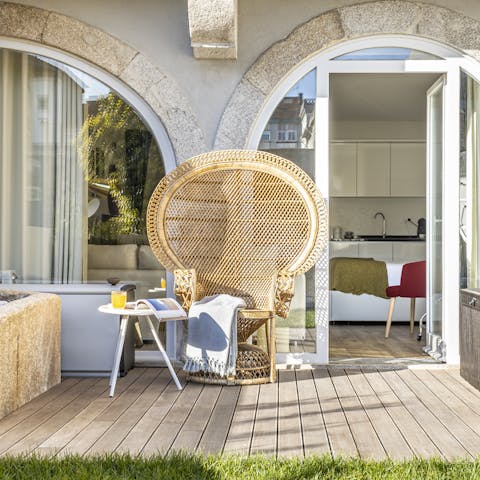 Catch some rays on the peacock chair in your private garden