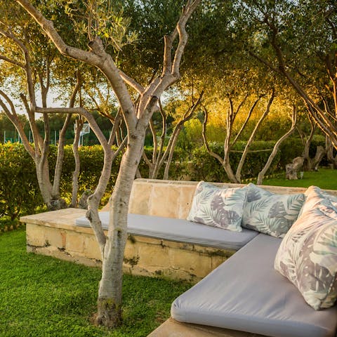 Curl up with a book at one of the garden's secluded seating areas