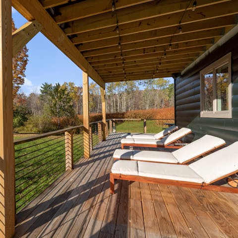 Enjoy serene garden views while relaxing on the deck