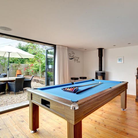 Play a few games of pool for some competitive family fun