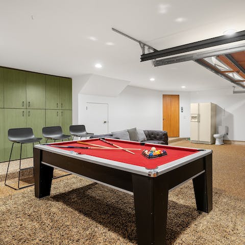 Host a pool tournament in the garage, a great way to escape the midday sun