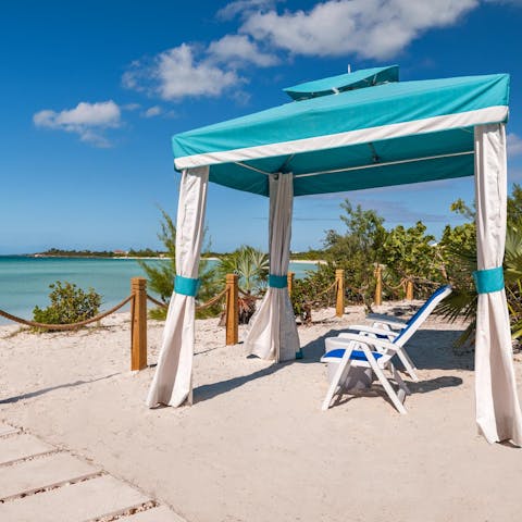Gaze out at the tropical Atlantic Ocean from your private seating area on the beach