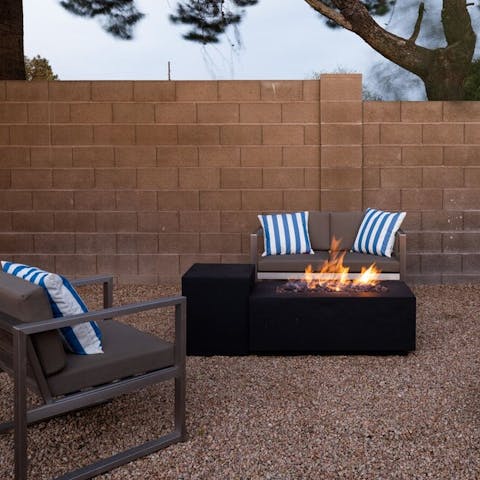 Gather together around the fire pit after dark
