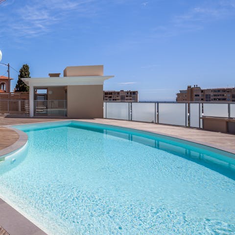 Dip into the refreshing waters of the shared rooftop pool