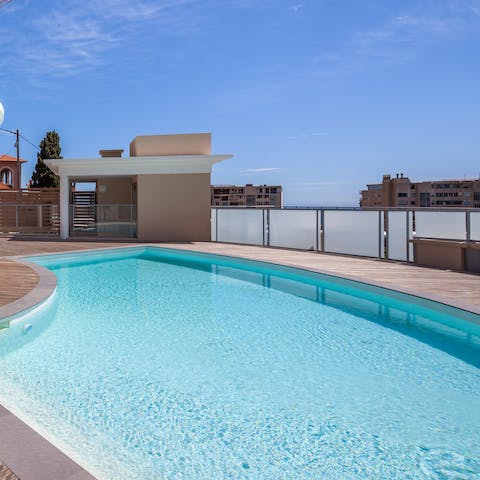 Dip into the refreshing waters of the shared rooftop pool