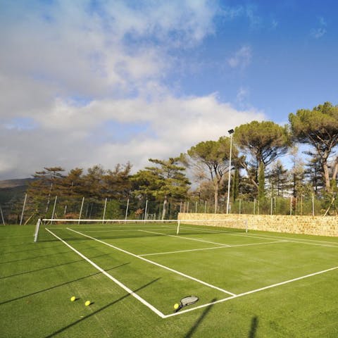 Practise your serve on the private tennis court