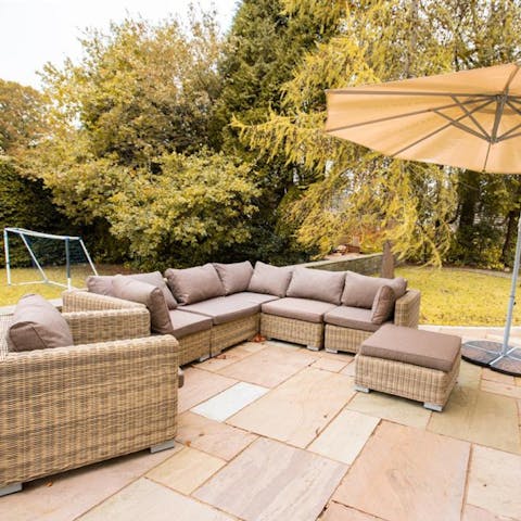 Spend balmy summer evenings catching up and enjoying drinks on the outdoor sofa