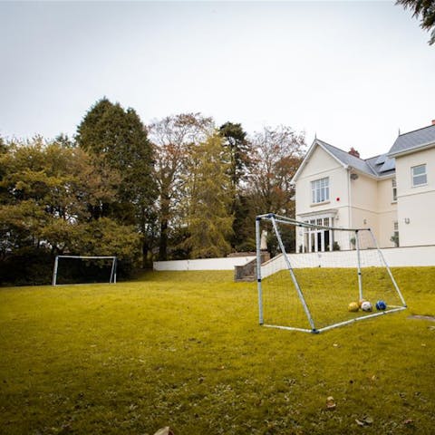 Make use of the huge garden space with a game or two of football