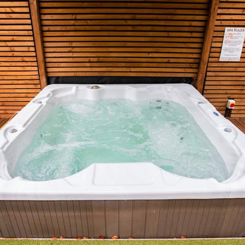 Pour yourself a glass of wine and relax into the bubbling hot tub