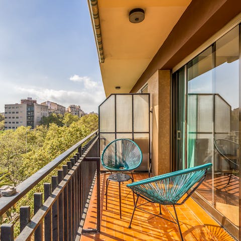 Soak up some rays on the balcony's Acapulco chairs, a glass of Spanish wine in hand 