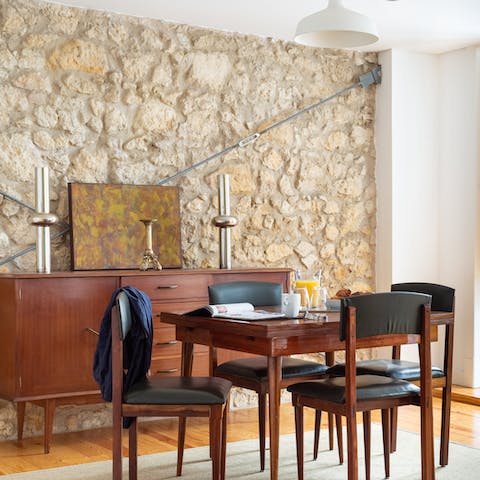 Eat meals with a classical stone wall as your backdrop