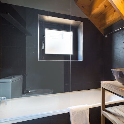 Treat yourself to a long and uninterrupted soak in the monochrome bathtub