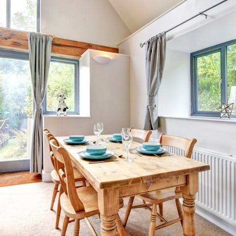 Enjoy homecooked meals around the farmhouse-style dining table, enjoying the garden view from your chair
