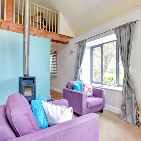 Spend cosy evenings relaxing by the fireplace on your cosy armchair, watching the TV